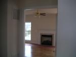 Foyer looking past basement door to right into family room