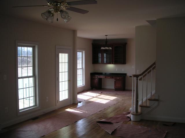Looking through family room to morning room back half of stairs visible