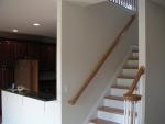 Looking up the back half of stairs and into the kitchen