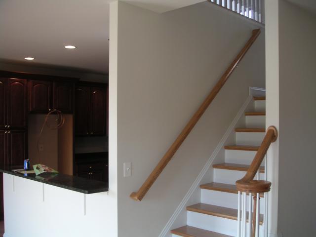 Looking up the back half of stairs and into the kitchen