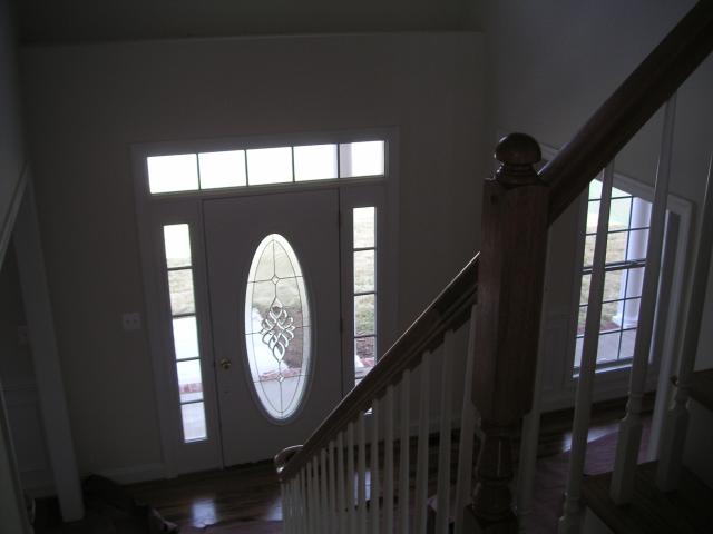 Looking down front half of stairs to the front door