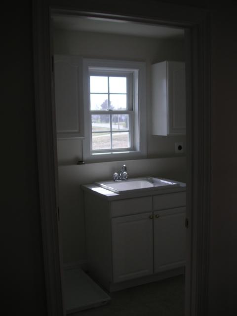 Laundry room with deep tub sink