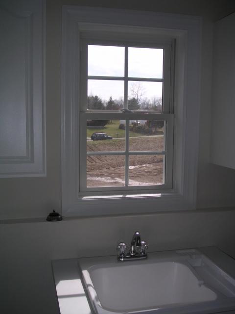 View from laundry room, can't wait to plant trees on the back birm between us and road