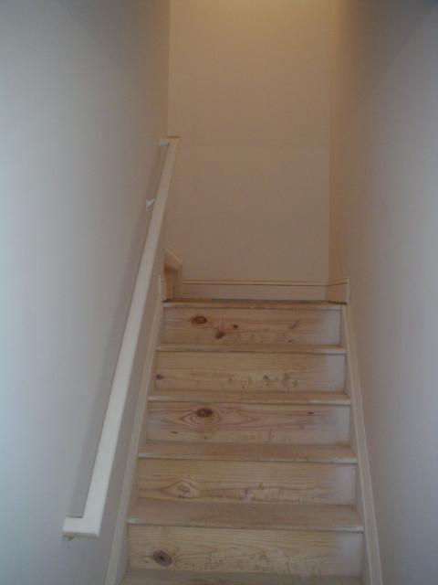 Basement stairs up, we might simply sand them and stain them and we think they'll look great