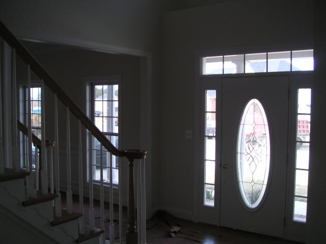 In front of basement door looking through foyer