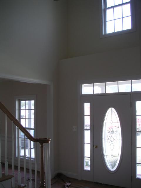 Tall show of foyer and plant shelf