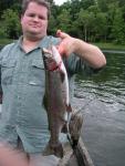 My 19 3/4" Rainbow Trout. The trout isn't looking good here, but he swam right off when released. 1/4" more and he wou